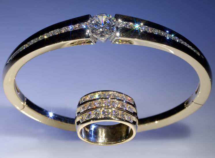 From a series shot with a custom-built, proprietary lighting system designed to capture the inner fire, fine jewelry sparkles for the camera. In this shot, an amazing diamond bangle and ring are paired with brilliant life showcased in the light. Jerry and Lois Photography