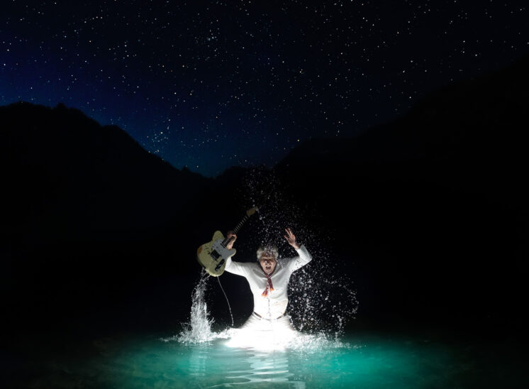 Part of a personal project: Founding Guitarist for the mega group HEART and Rock and Roll Hall of Fame Inductee, Roger Fisher, making a glowing splash in a mountain lake with the Northern Sky above. Jerry and Lois Photography