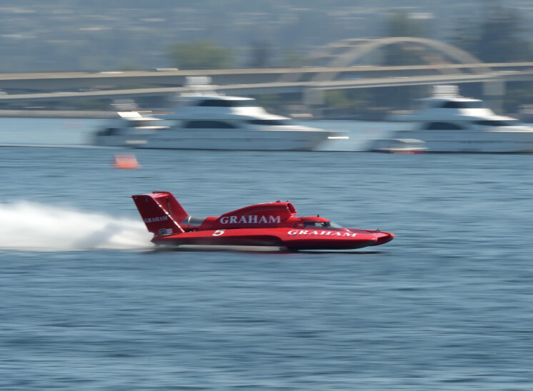 Part of a series during Seattle's Seafair, a speeding hydroplane races by, tack-sharp against motion-blurred surroundings. © Jerry and Lois Photography, all rights reserved