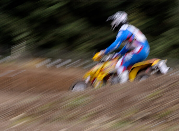 Part of a series for a Quad Motocross National Champion, cruising past at 60+ mph, allowing structured motion blur for the entire shot. © Jerry and Lois Photography, all rights reserved