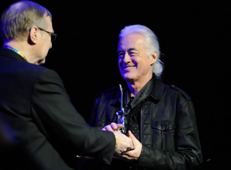 Jimmy receiving EMP/MoPOP Founder's Award from world-visionary Paul Allen. © Jerry and Lois Photography