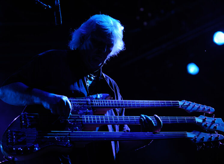 World class, Prog Rock bassist and RRHoF inductee, Chris Squire with his custom triple neck bass in dramatic blue stage light. Jerry and Lois Photography