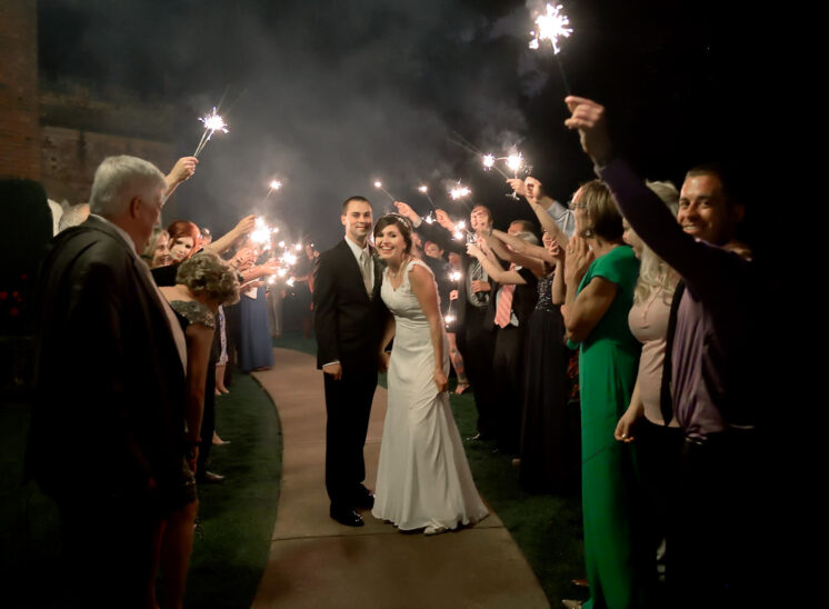 Wedding grand finale: Newly weds walk under a canopy of sparklers. Jerry and Lois Photography